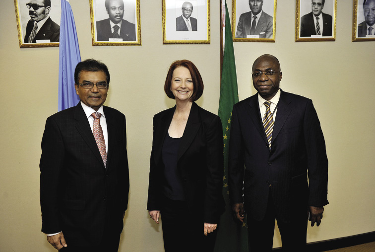 The Australian Prime Minister, Julia Gillard (centre), is welcomed to her meeting with the African Group Permanent Representatives to the United Nations by the Permanent Representative of Mauritius, Milan JN Meetarbhan (left), and the Ambassador of the Permanent Observer Mission of the African Union to the United Nations, Téte António, New York, 10 March 2011. [Prime Minister's Office]