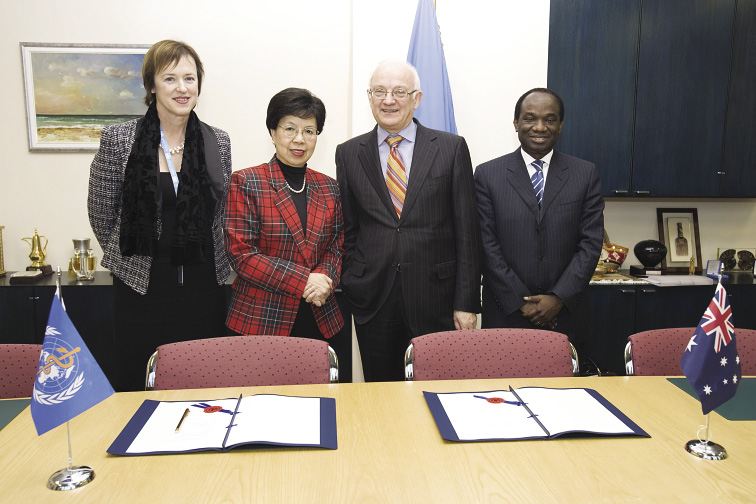 The Australian Parliamentary Secretary for International Development Assistance, RF (Bob) McMullan (second right), and the Director-General of the World Health Organization, Dr Margaret Chan (second left), are joined by the Australian Permanent Representative to the United Nations at Geneva, Caroline Millar (left), and WHO Deputy Director-General Dr Anarfi Asamoa-Baah, following the signing of the 'Partnership Framework between the Australian Government (represented by the Australian Agency for Internationa