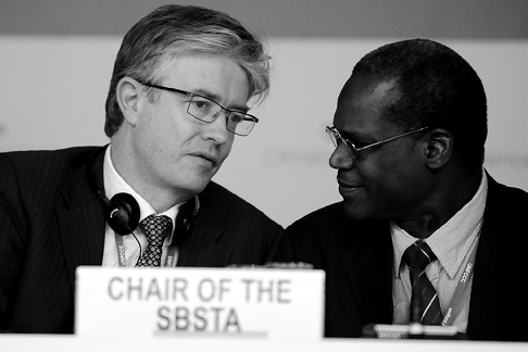 The Australian Chair of the Subsidiary Body for Implementation, Robert Owen-Jones (left), and the Mali Chair of the Subsidiary Body for Scientific and Technological Advice, Mama Konaté, speaking together at the UN Climate Change Conference, Bonn, June 2011. [IISD/Earth Negotiations Bulletin]