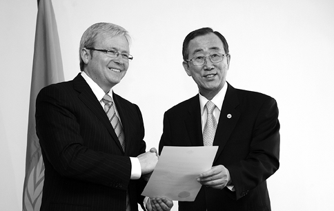 The Australian Prime Minister, Kevin Rudd (left), hands over the instrument of ratification of the Kyoto Protocol to the UN Secretary-General, Ban Ki-moon, Bali, 12 December 2007. [UN Photo/Evan Schneider]