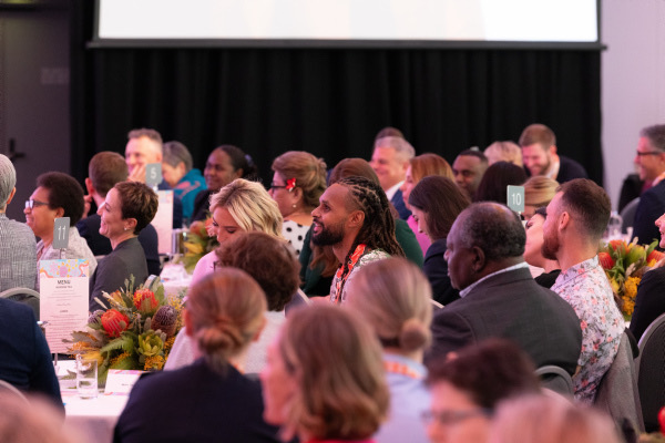 Attendees at the symposium listening to a presenter