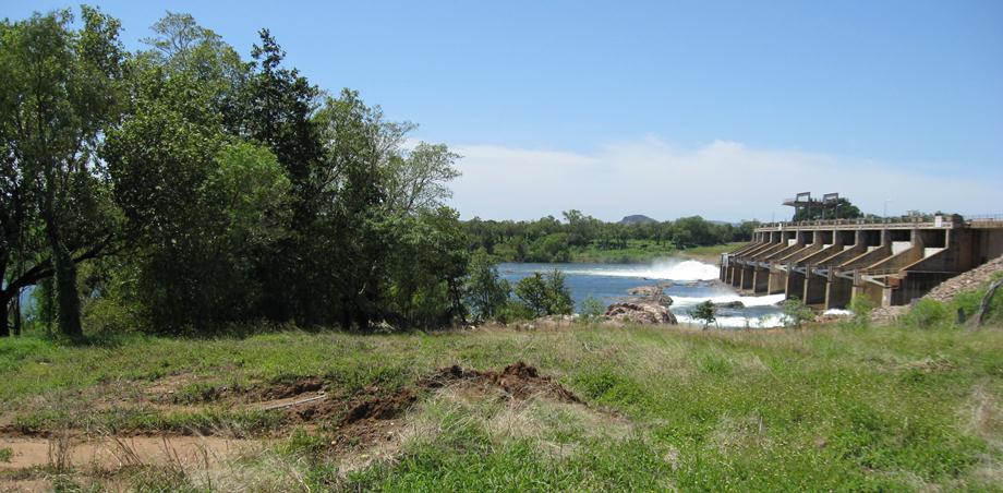 Excess water flowing over the spillway.