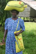 Solomon Islands women carrying emergency food