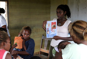 A woman holding a booklet about nutrition