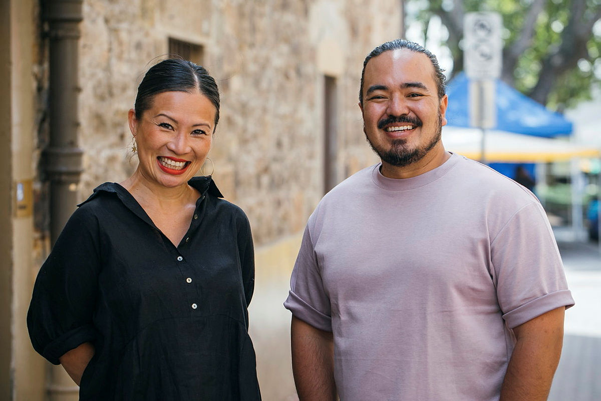 Poh Ling Yeow and Adam Liaw grinning out in the street