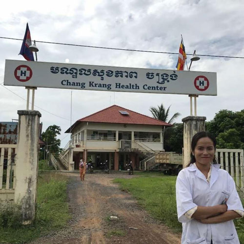 Woman standing in front of Health Centre.