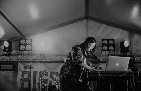 Woman working on a laptop on a large stage