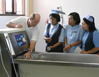 Photo of Sean Birgan training Bali nurses in the use of specialist burns equipment