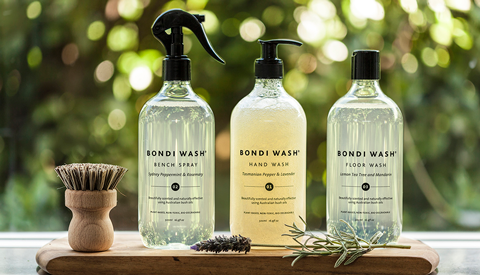 Bottles of Bondi Wash sitting on a wooden board