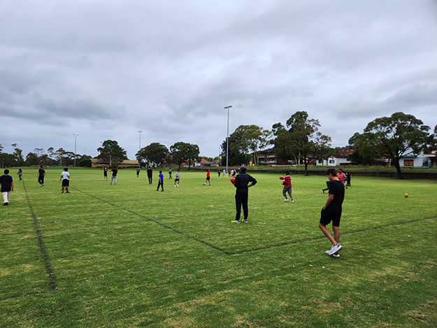 Group of people of a soccer field practising skills