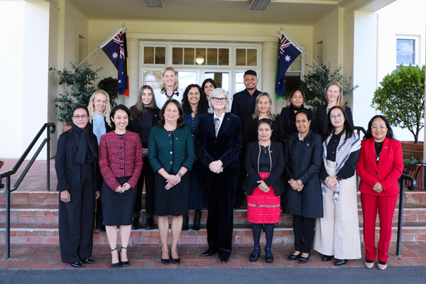 A large group of people standing at the entrance to Government House, Canberra