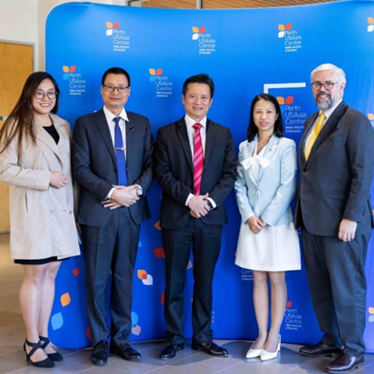 Two women and three men standing in front of a Perth USAsia Centre banner