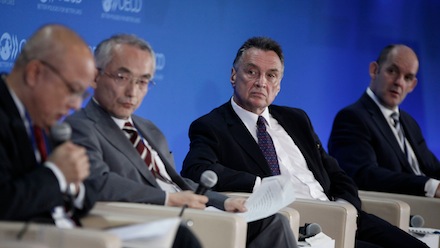 Minister Emerson and others sat at a panel table at the OECD.