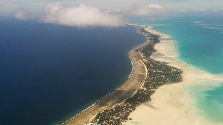 Aireal photograph of a road along a coastline