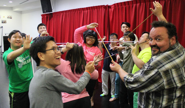 Group of people playing with string