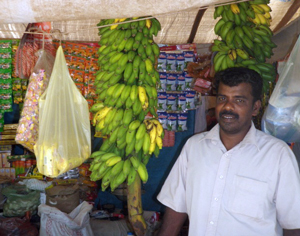 Nesan in front of his newly re-opened shop.