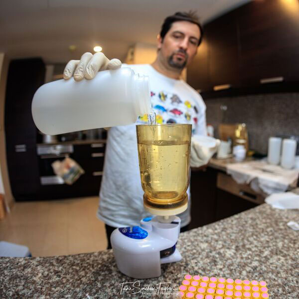 Man pouring water into a cup