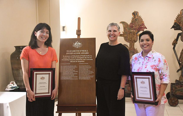 Elizabeth O’Neill Journalism Award recipients standing with their awards. 