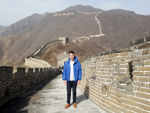 Elliott Johnson standing on the Great Wall of China