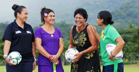 Four women talking, laughing