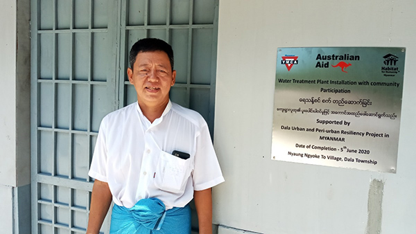 Mr. U Soe Tint in front of the new water treatment plant