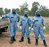 Thumbnail photo of three inspectors wearing blue protective equipment.