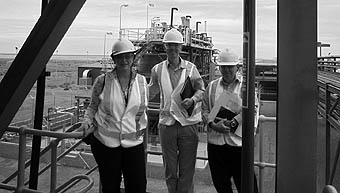 Photo of 3 people wearing safety helmets and visibility jackets at Honeymoon Mine.