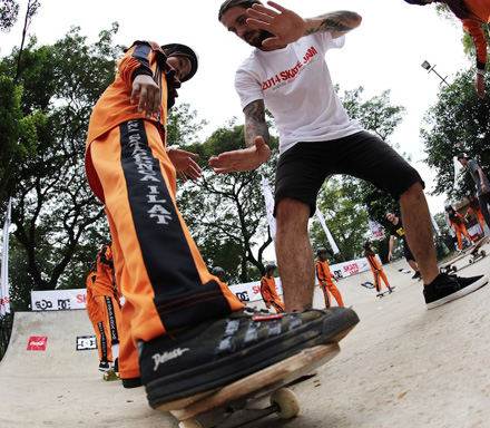 A Skateboarding Australia (SbA) instructor teaches a student from one of the schools built under Australia's Education Partnership with Indonesia how to stabilise herself on the skateboard. The Australian Embassy collaborated with SbA to bring instructors who could offer Indonesian youth a chance to try this popular Australian sport. 