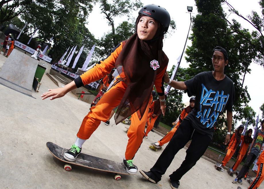 A student from secondary school SMPN Satu Atap Rancailat balances on a skateboard for the first time at the Australian Embassy's Skate Jam event in Jakarta. This secondary school is one of 451 built so far under Australia's Education Partnership with Indonesia. The program plans to support the construction of more than 300 more schools in remote and rural areas in Indonesia in the coming year.