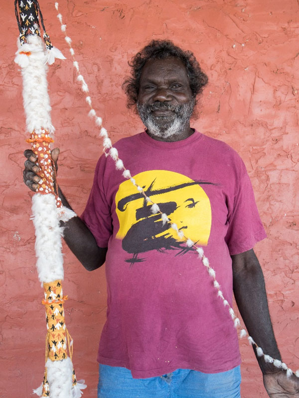 Raymond Bulambula holding a didjeridu