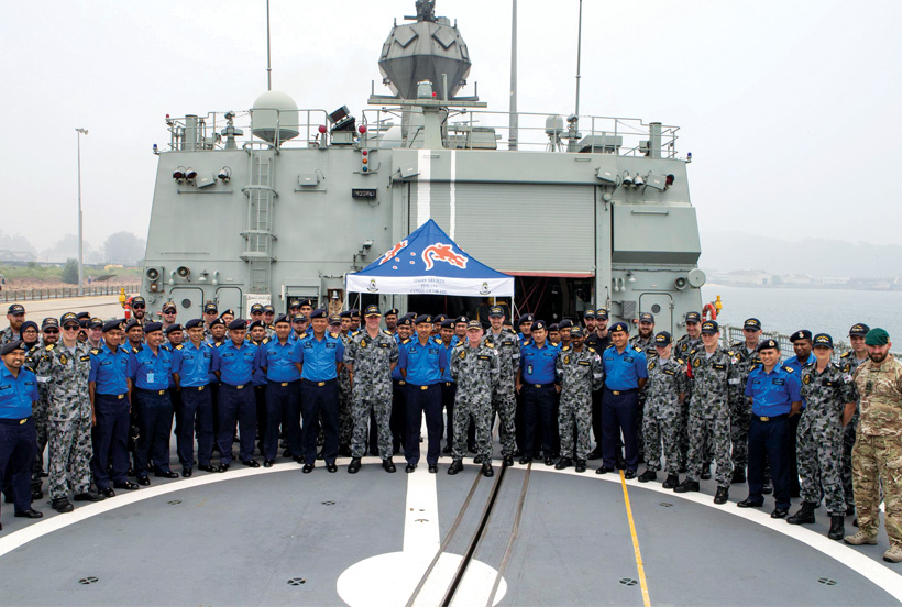 Photo of Royal Malaysian Navy officers visit HMAS Arunta at the port of Kemaman