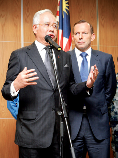 Photo of Tony Abbott and Najib Razak at a press conference