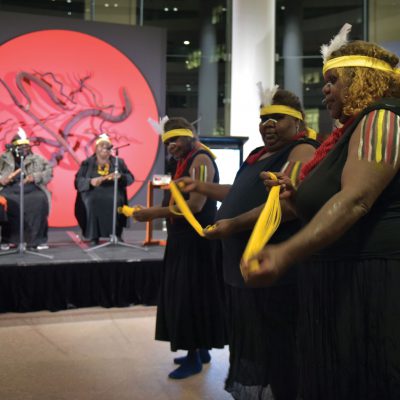 Indigenous women from the Central and Western Deserts performing the story of the Seven Sisters at NAIDOC celebrations at the department in Canberra: dancers Francie Ingkatji, Pantitji Lewis and Alison Carol; singers Inawinytji Williamson, Rene Kulitja and Yaritji Heffernan [Mark Graham Media]