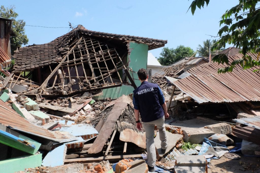 Departmental officer Charles Thursby-Pelham surveying damage caused by earthquakes in North Lombok, Indonesia [DFAT/Piter Edward]