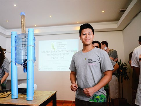 Tim with a device made from a large water bottle