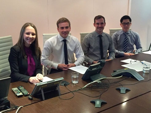 Students sitting in a conference room.