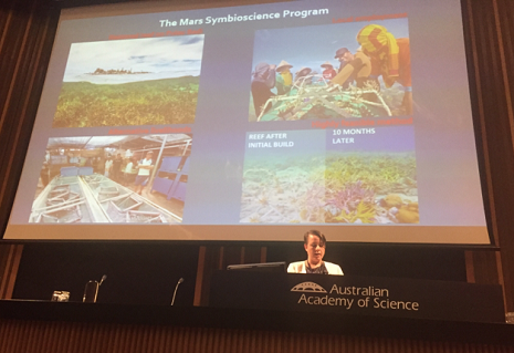 Cherie speaking in front of a slide titled The Mars Symbioscience Program