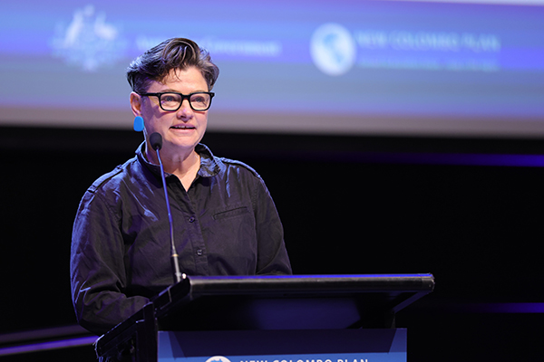 Rhona McPhee speaking at a lectern.