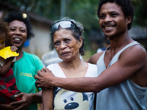 Photo of a man holding an elderly woman.