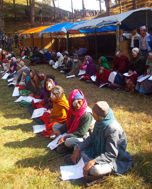 Patients wait to have their eye patches removed after surgery.