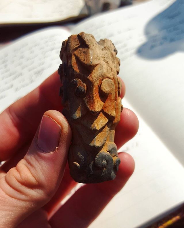 A part of the stem of an ornate smoking pipe in the form of a face (approx. 17th Century AD - ceramic) from the Wat Ban Vieng site. (Photo Credit: Nigel Chang)