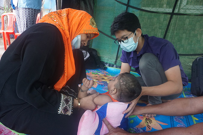 A staff from the Myanmar Humanitarian Fund monitors the primary and reproductive health services run at a rural health centre in Sittwe.