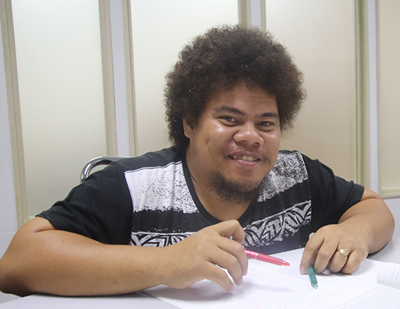 A man sitting at a table studying