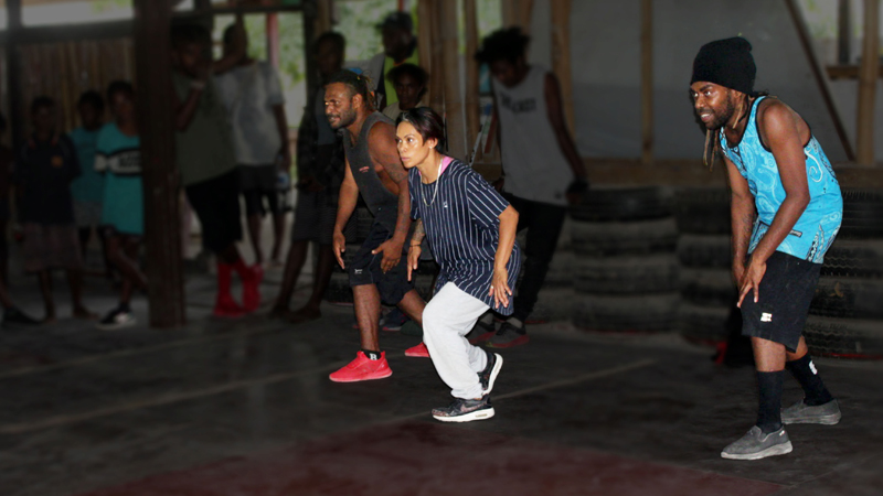 Three hip hop dancers together ready to begin dancing