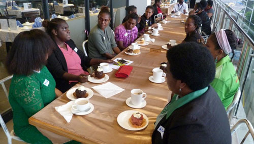 Leila networking with female leaders and journalists.