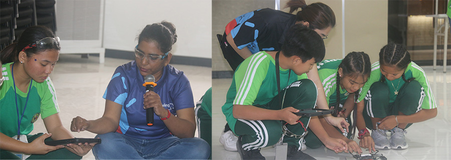 Groups of students learning about drones