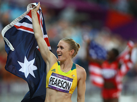 Sally Pearson holding the Australian flag