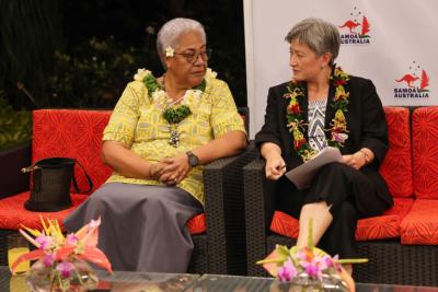 Photo of Penny Wong and Fiame Naomi Mata’afa sitting on a couch engaged in discussion.