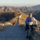 Photo of Mitchell Francis climbing the Great Wall of China.