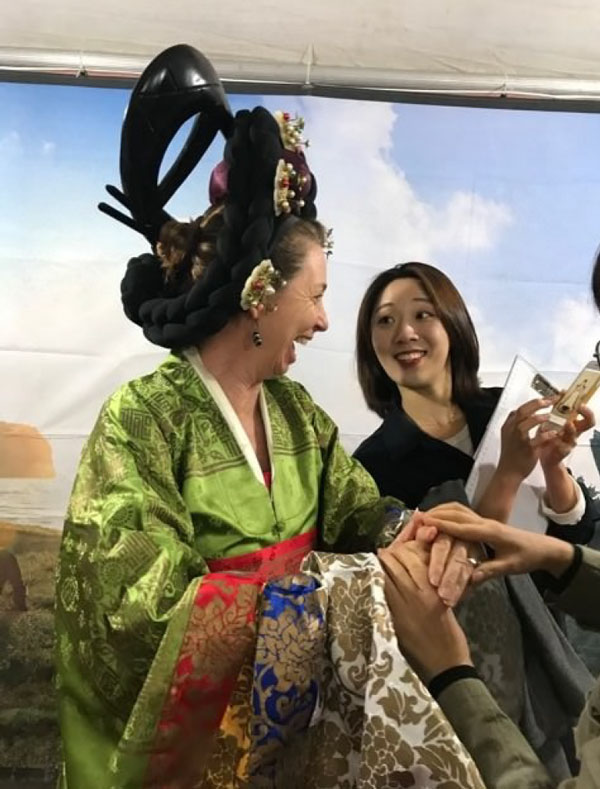 Woman wearing elaborate Japanese tradional clothing and hair style